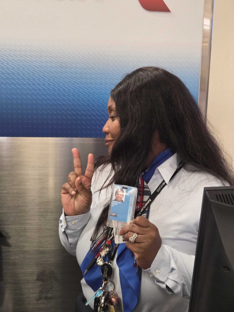 Arkelia Rose showing her badge at DFW Airport
